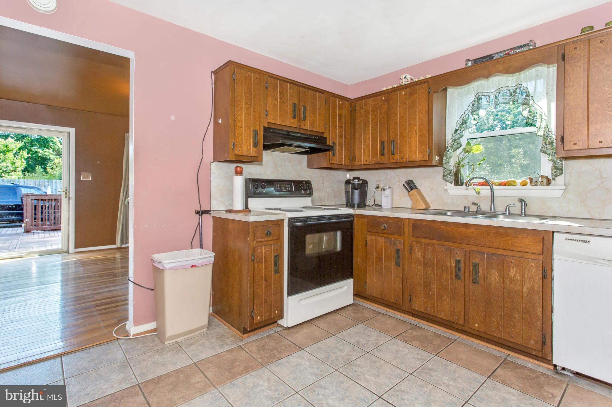 1838 Pleasant View Road Adamstown, MD 21710 - Photo 11 of 26 a kitchen with a sink a stove top oven and a window