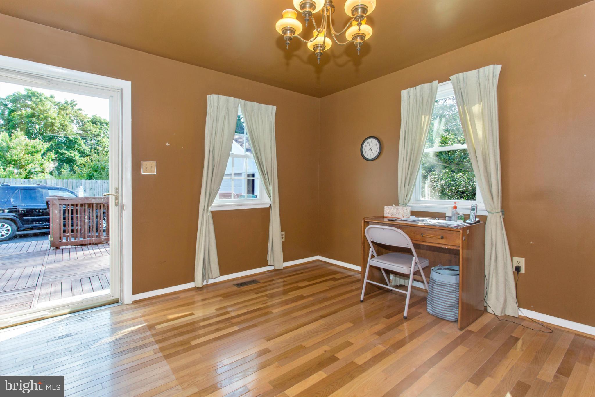 1838 Pleasant View Road Adamstown, MD 21710 - Photo 14 of 26 a furnished dining room with a window and wooden floor