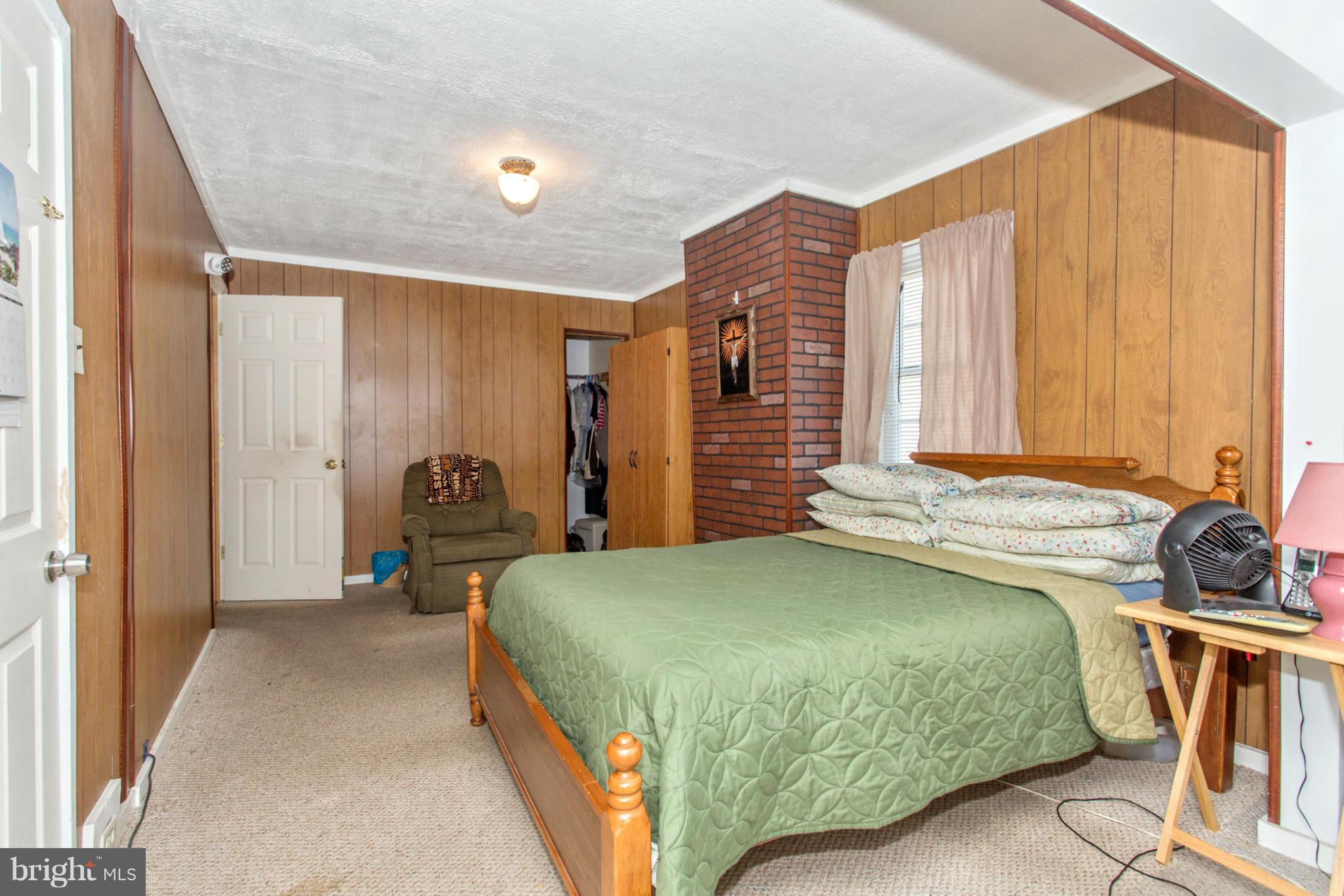 1838 Pleasant View Road Adamstown, MD 21710 - Photo 17 of 26 a bedroom with a bed and a table