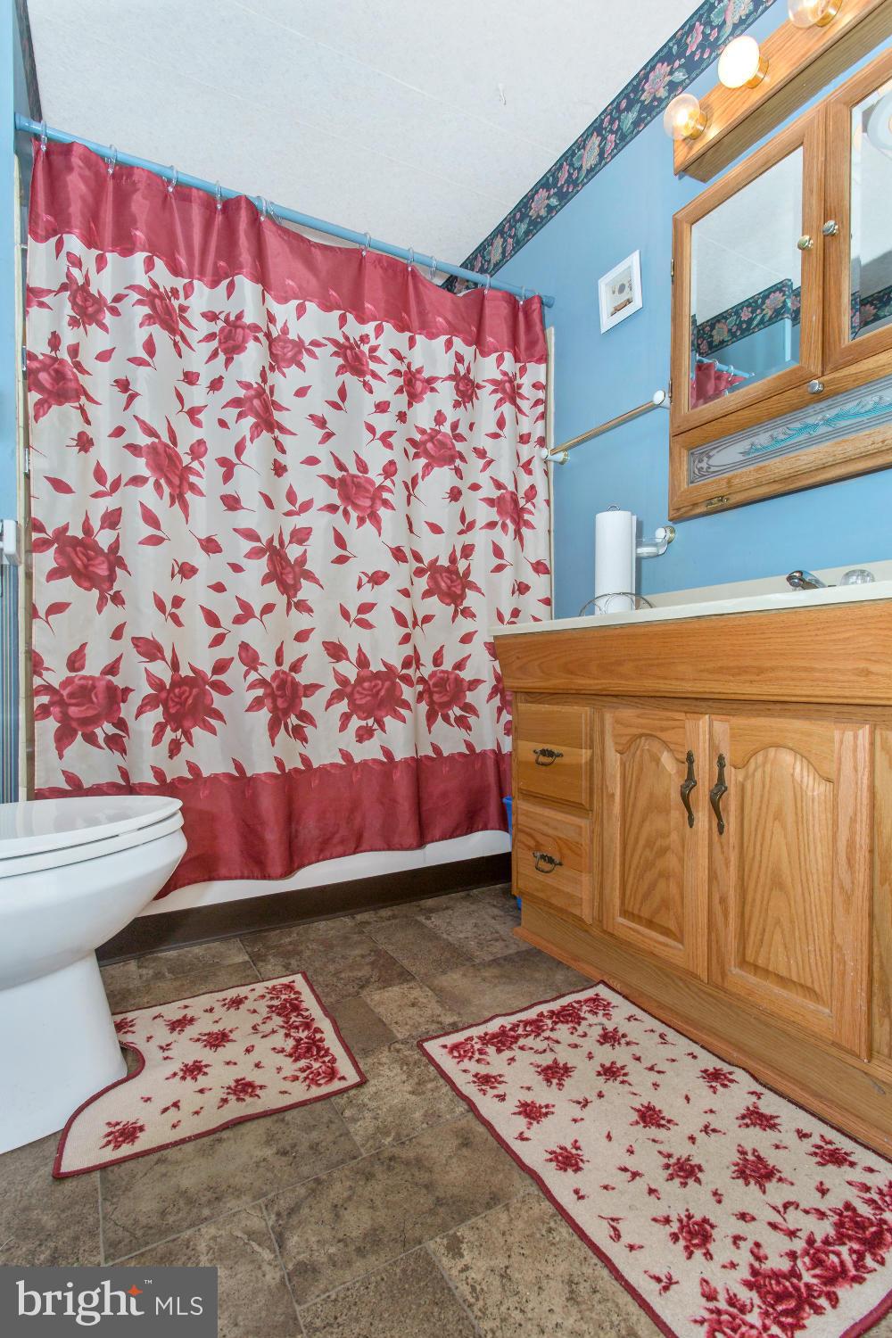 1838 Pleasant View Road Adamstown, MD 21710 - Photo 18 of 26 a view of a bedroom with wooden floor and a bookshelf