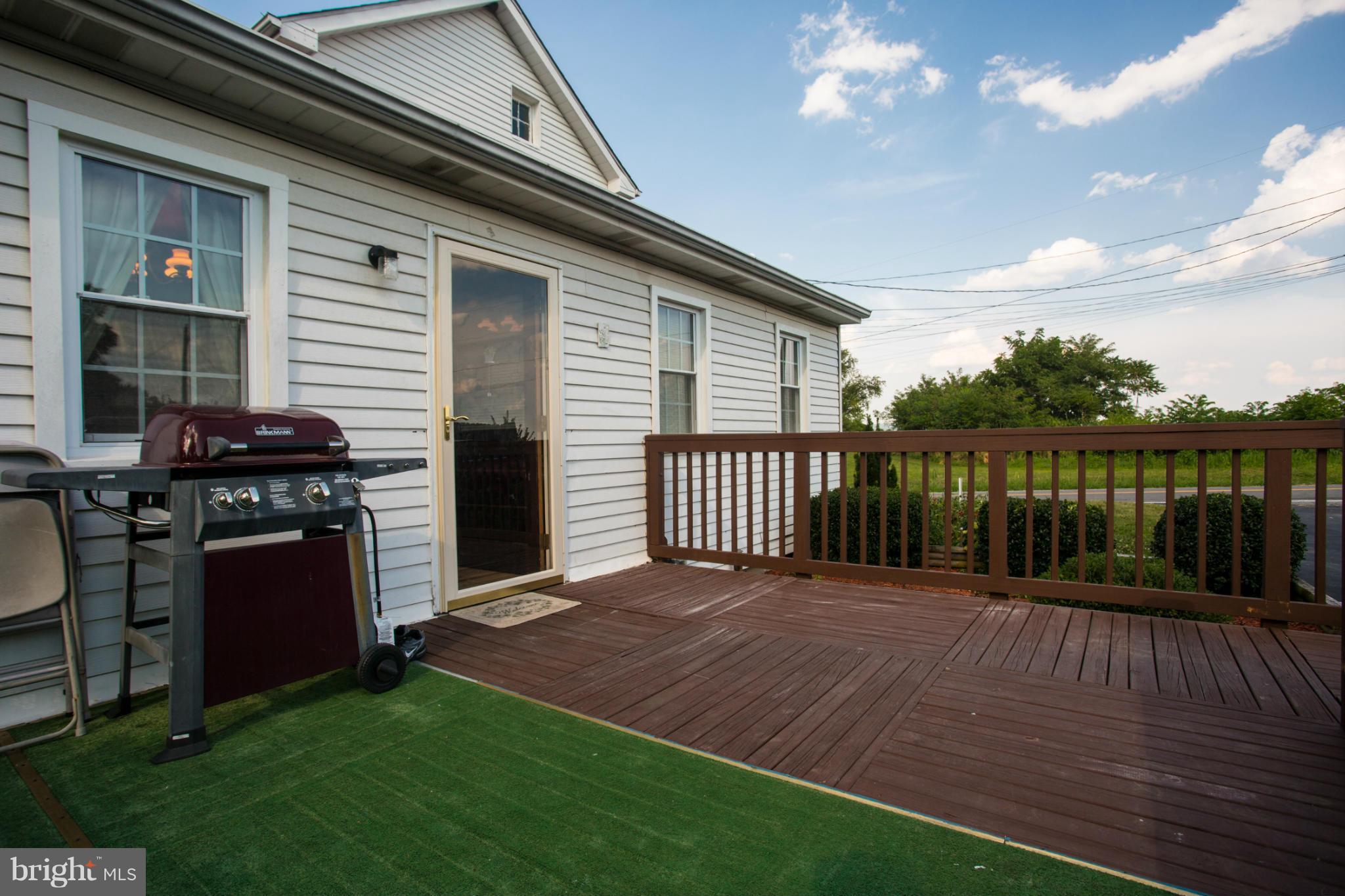 1838 Pleasant View Road Adamstown, MD 21710 - Photo 3 of 26 a view of a backyard with wooden floor and fence
