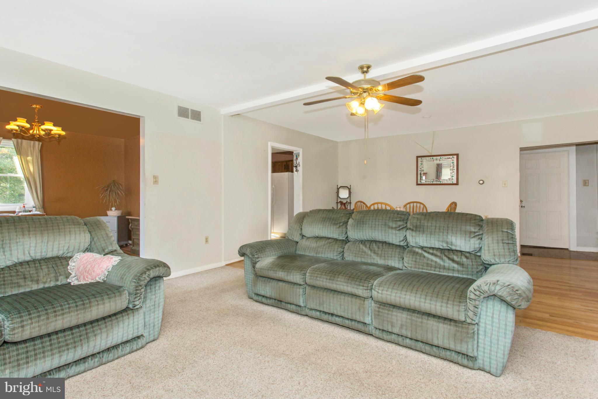 1838 Pleasant View Road Adamstown, MD 21710 - Photo 6 of 26 a living room with furniture and a chandelier