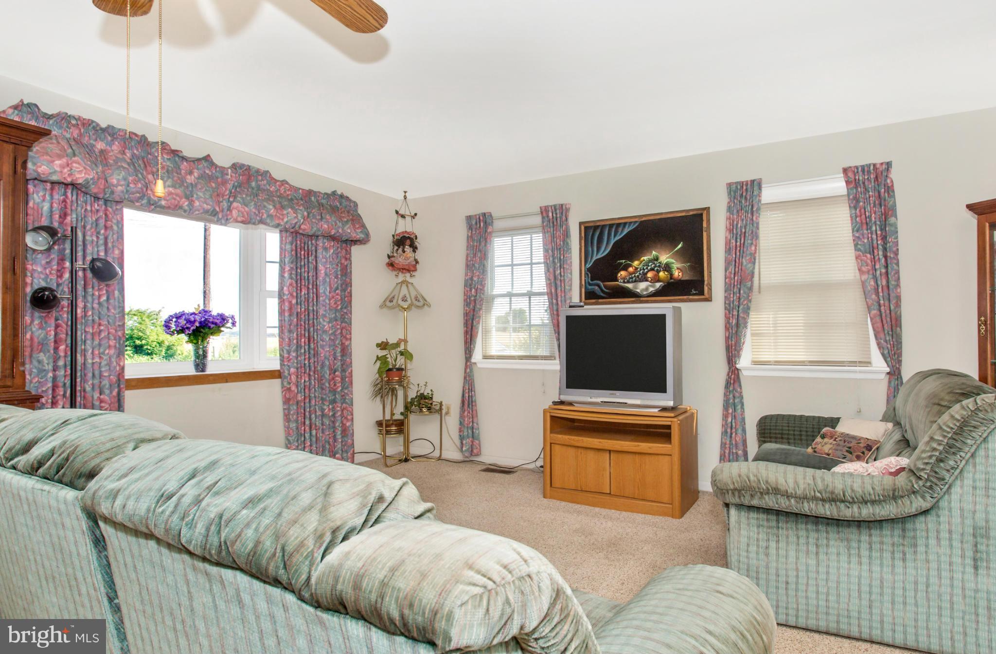 1838 Pleasant View Road Adamstown, MD 21710 - Photo 7 of 26 a living room with furniture and a flat screen tv
