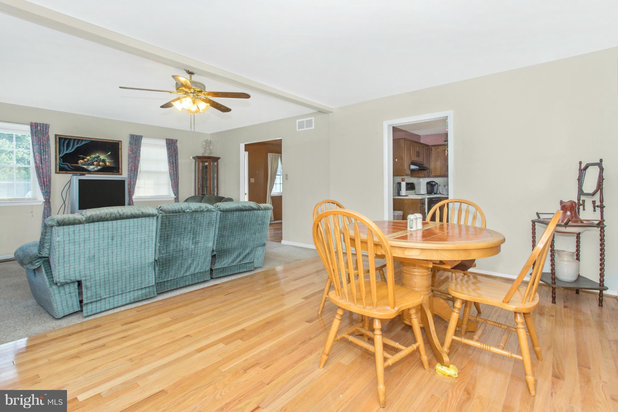 1838 Pleasant View Road Adamstown, MD 21710 - Photo 8 of 26 a view of a dining room with furniture and wooden floor
