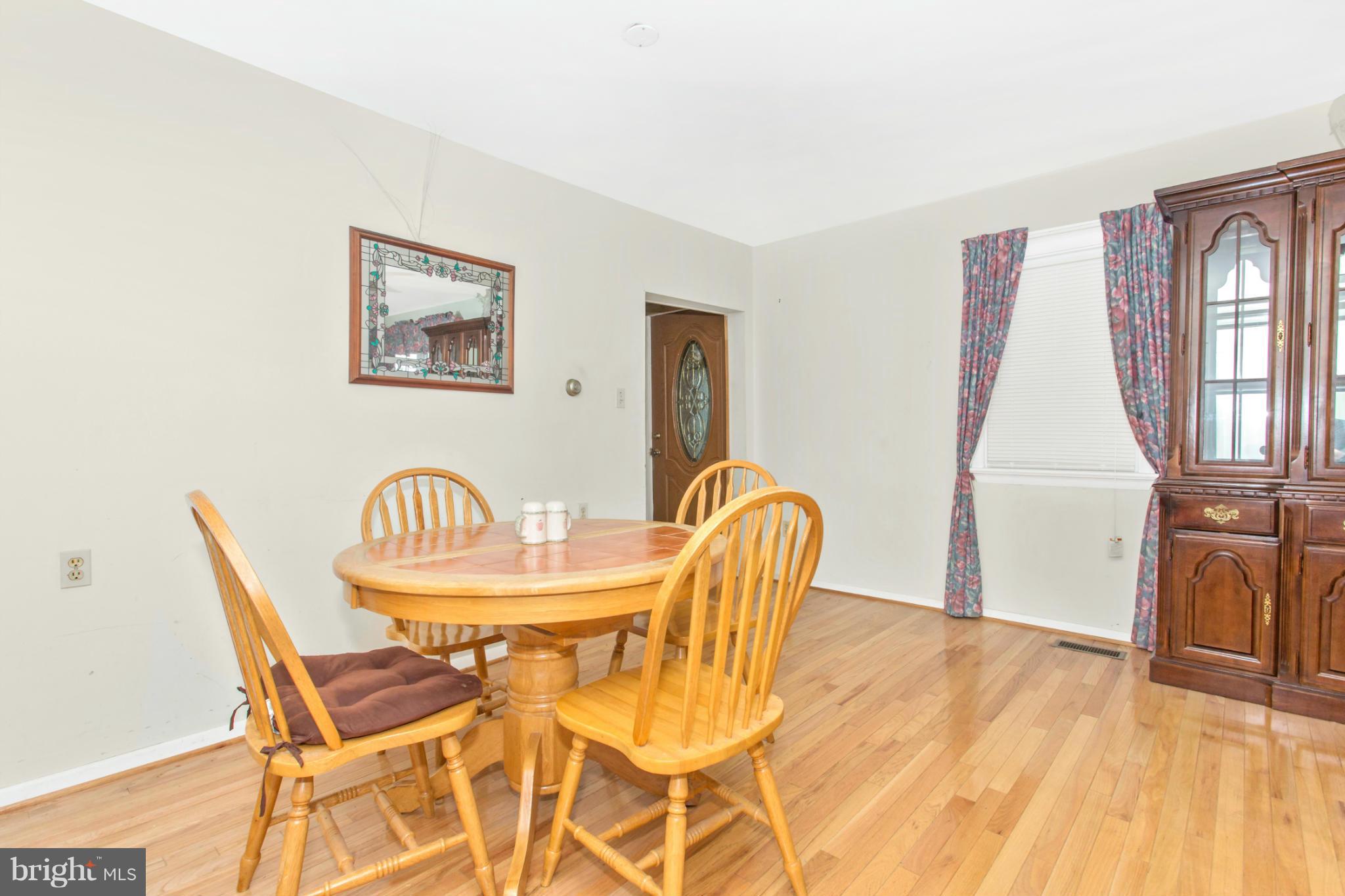 1838 Pleasant View Road Adamstown, MD 21710 - Photo 9 of 26 a view of a dining room with furniture and wooden floor