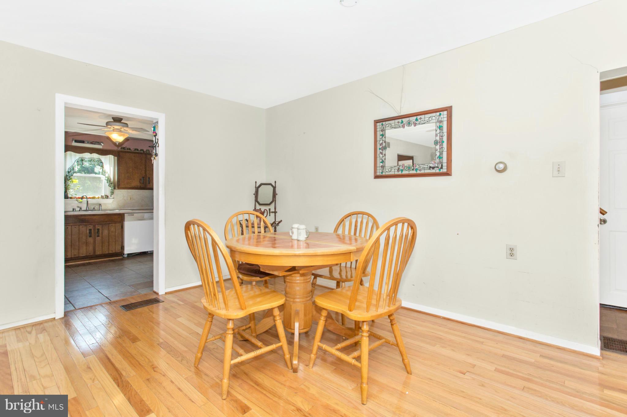 1838 Pleasant View Road Adamstown, MD 21710 - Photo 10 of 26 a view of a dining room with furniture and wooden floor
