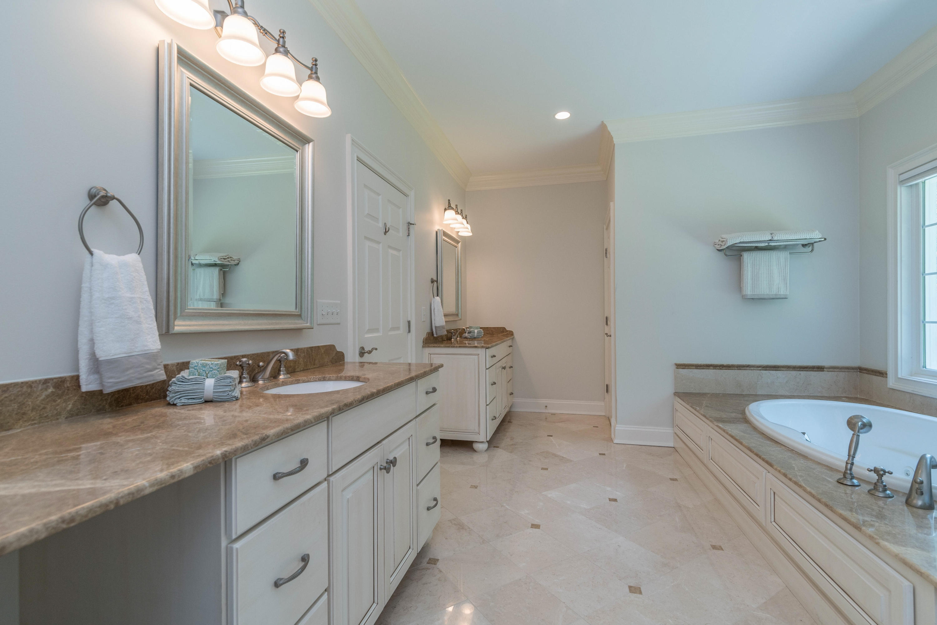 42 Mariomi Road New Canaan, CT 06840 - Photo 19 of 28 a bathroom with a double vanity sink mirror and bathtub