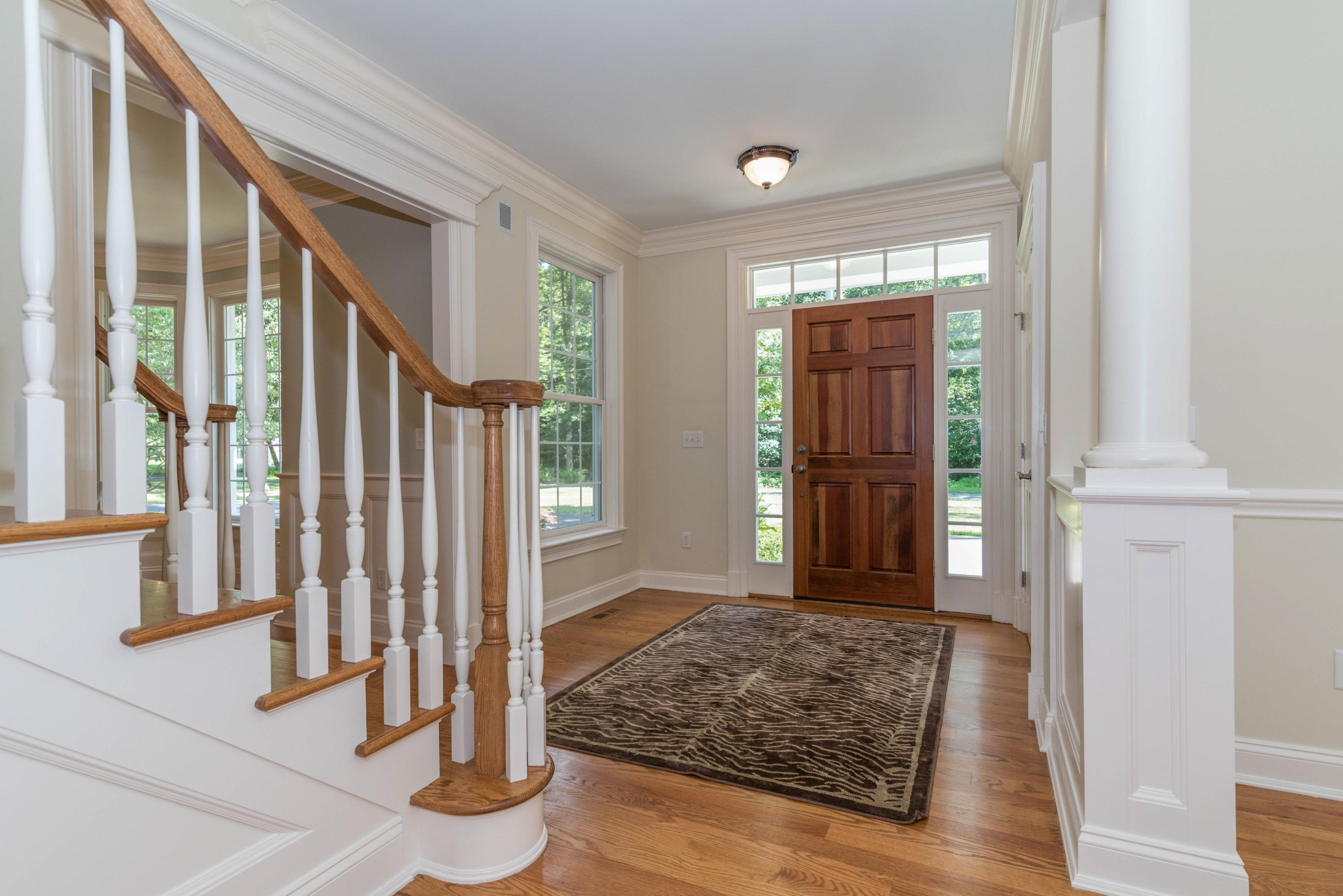 42 Mariomi Road New Canaan, CT 06840 - Photo 3 of 28 a view of a hallway with wooden floor and staircase