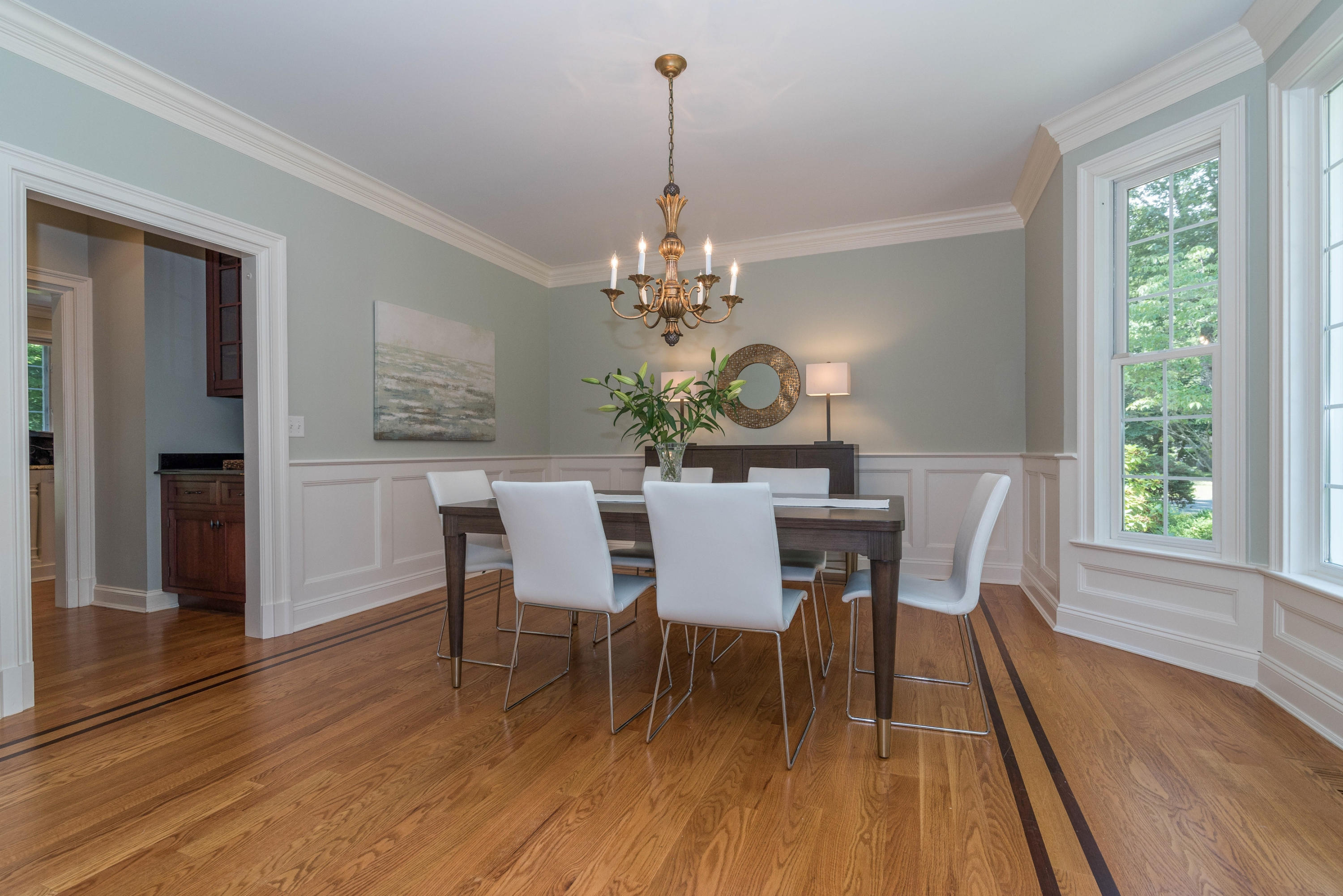 42 Mariomi Road New Canaan, CT 06840 - Photo 6 of 28 a dining room with furniture a chandelier and wooden floor