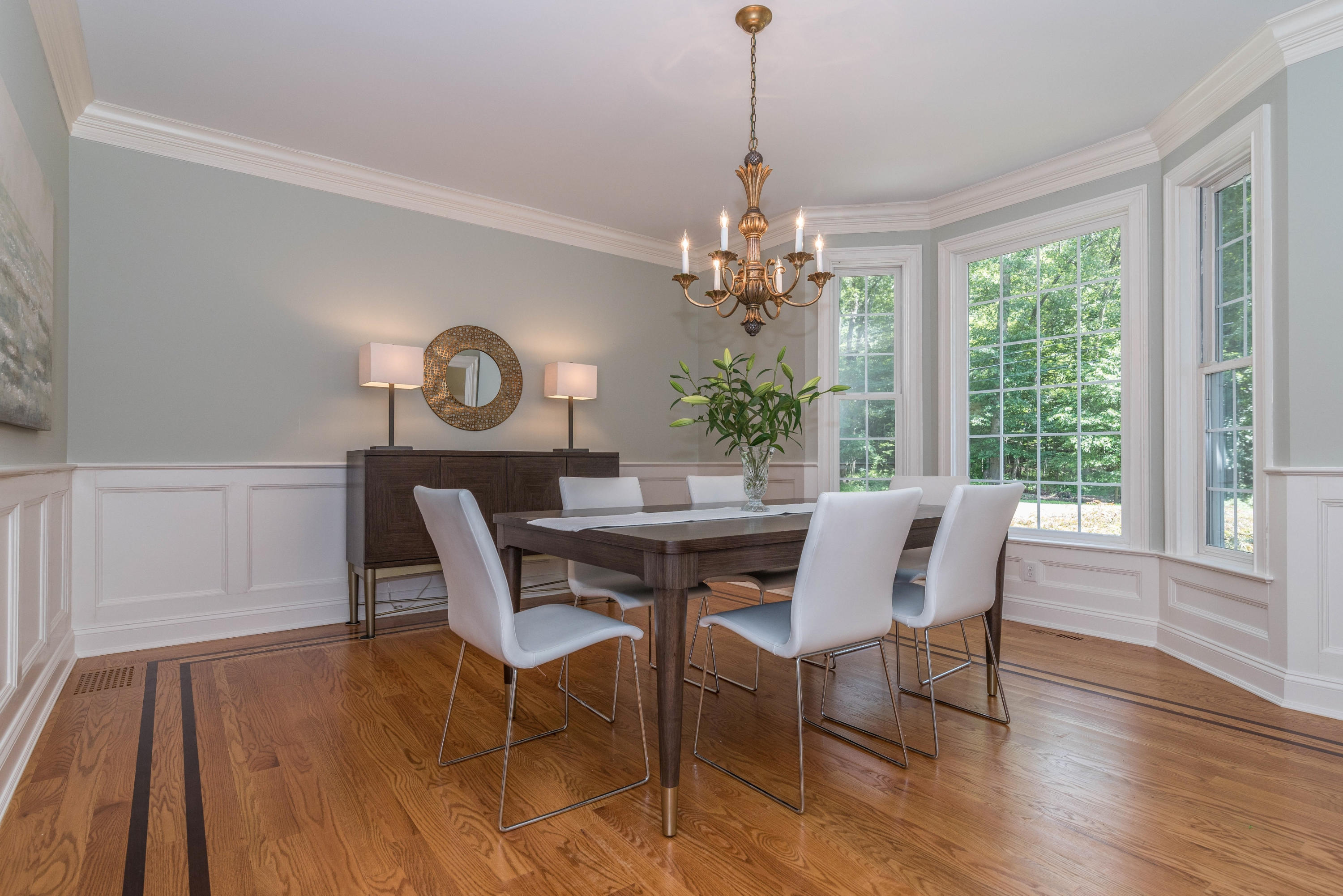 42 Mariomi Road New Canaan, CT 06840 - Photo 7 of 28 a view of a dining room with furniture window and wooden floor