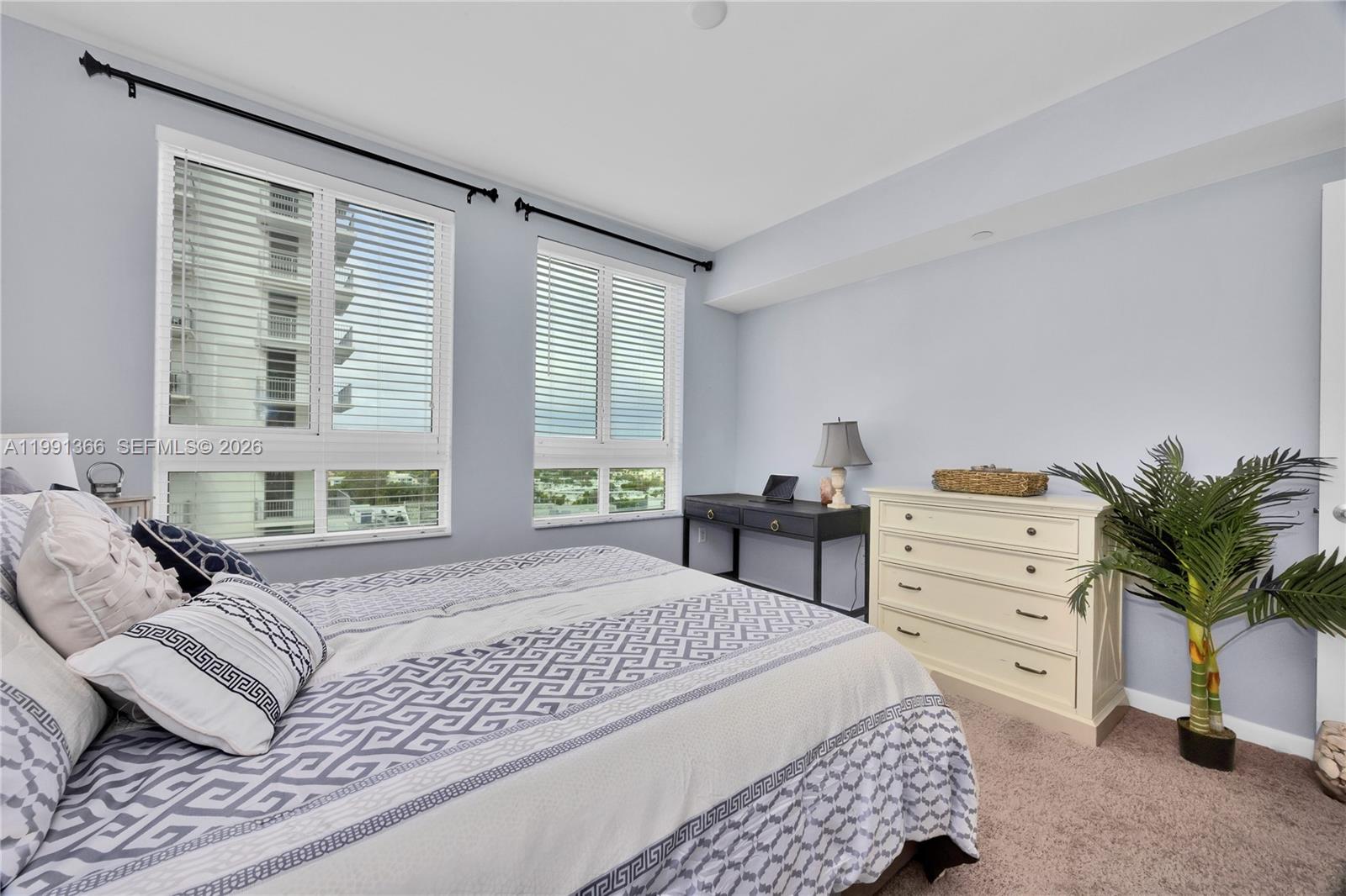 7350 Southwest 89th Street, Unit 1511S Miami, FL 33156 - Photo 13 of 29 a bedroom with a bed and a couch