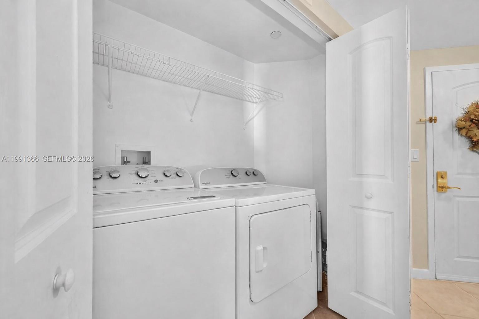 7350 Southwest 89th Street, Unit 1511S Miami, FL 33156 - Photo 16 of 29 a utility room with dryer and washer