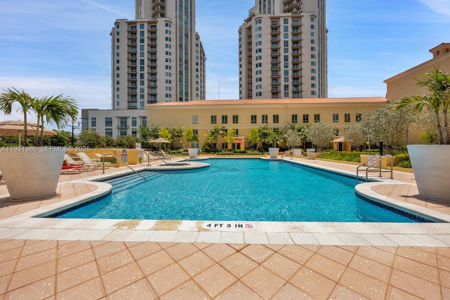 7350 Southwest 89th Street, Unit 1511S Miami, FL 33156 - Photo 20 of 29 a view of a swimming pool and a yard