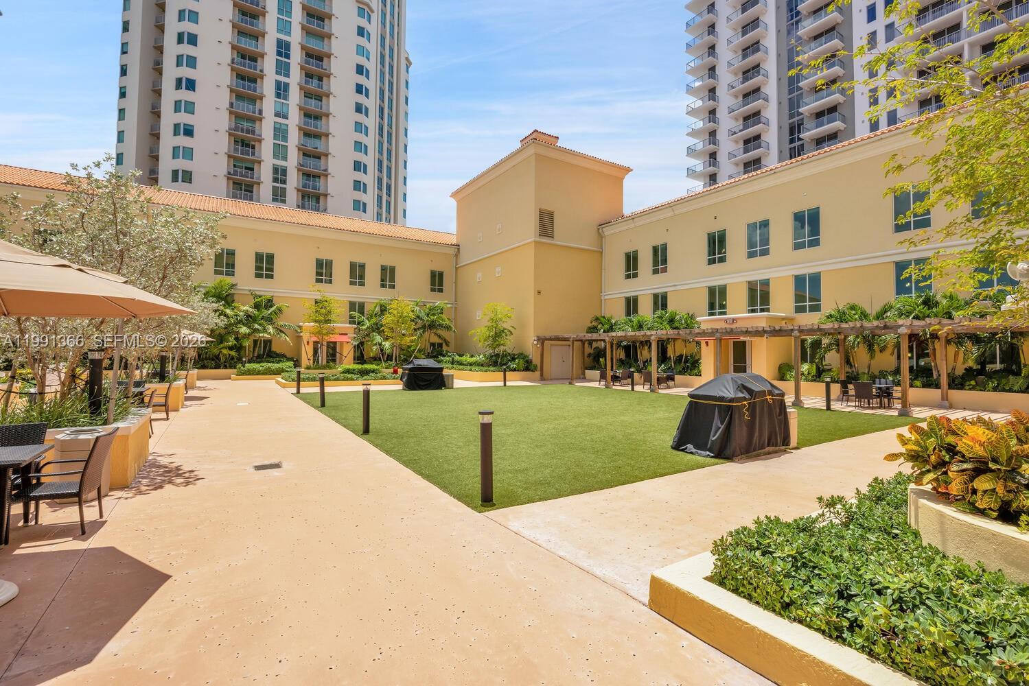 7350 Southwest 89th Street, Unit 1511S Miami, FL 33156 - Photo 21 of 29 a view of a building with many windows