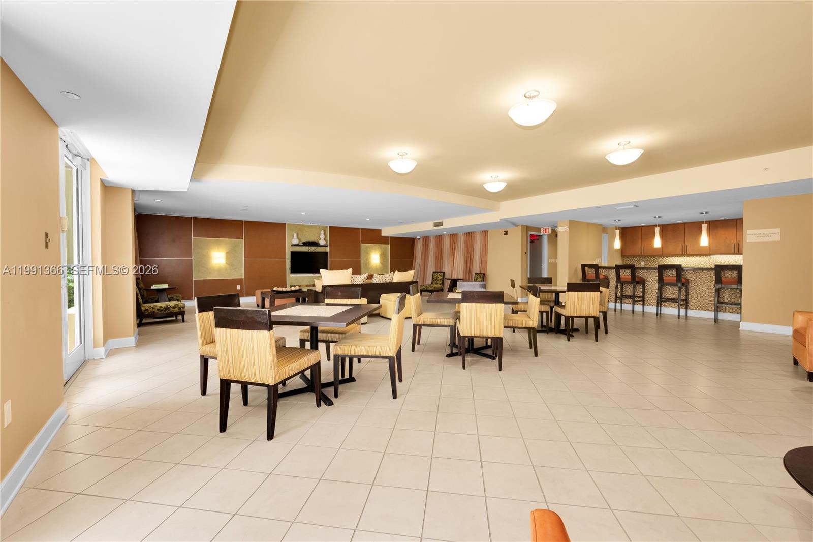 7350 Southwest 89th Street, Unit 1511S Miami, FL 33156 - Photo 27 of 29 a group of people sitting in a living room