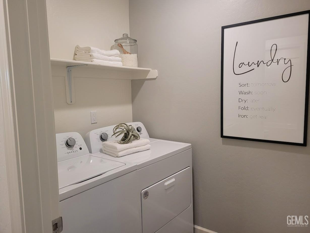 Undisclosed Address Bakersfield, CA 93307 - Photo 11 of 23 a utility room with dryer and washer