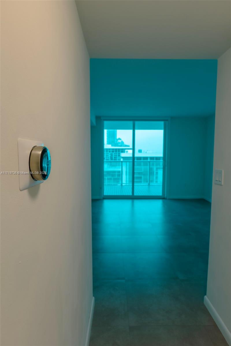 2101 Brickell Avenue, Unit 2103 Miami, FL 33129 - Photo 17 of 35 a view of an empty room with a window