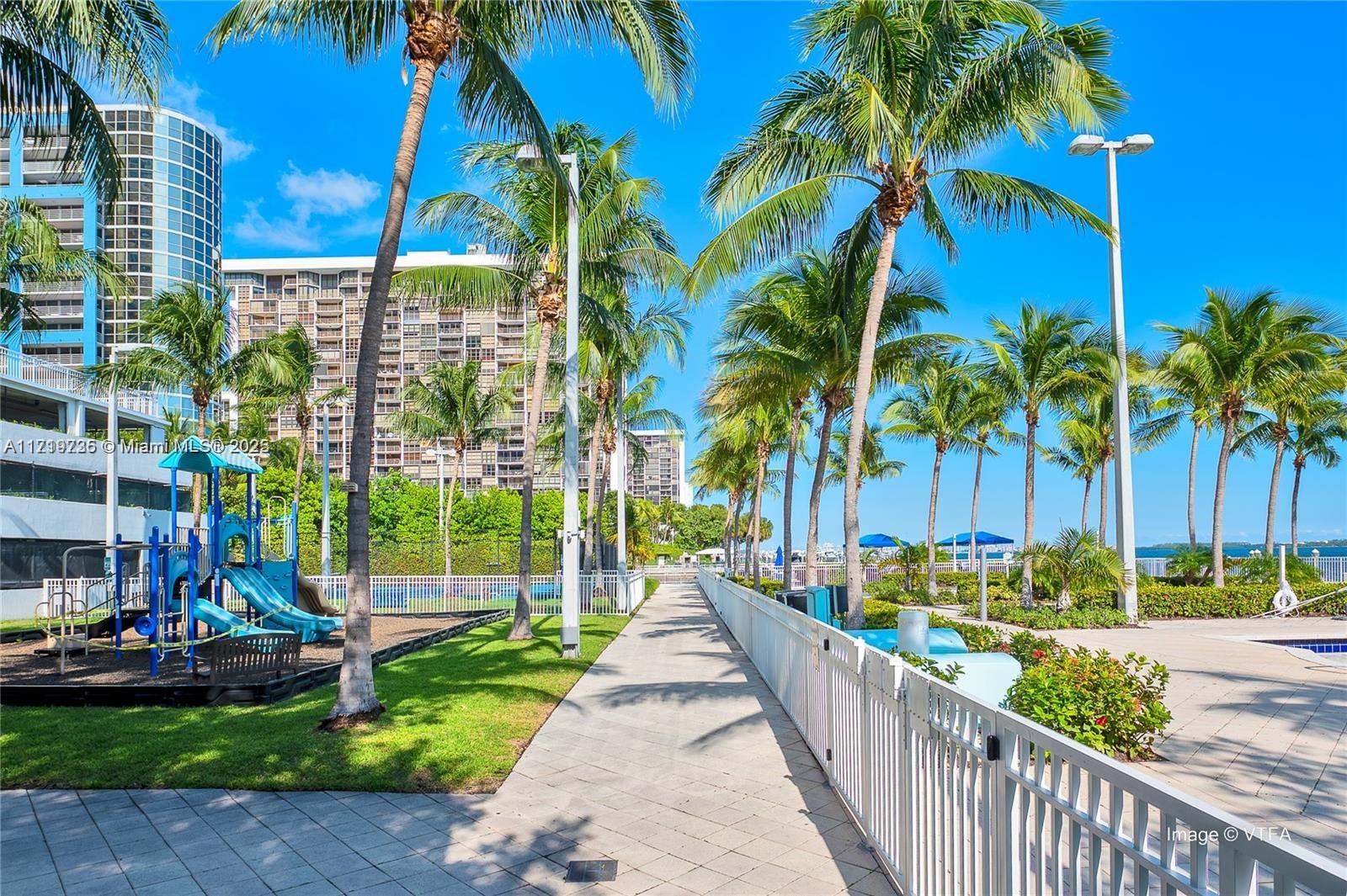 2101 Brickell Avenue, Unit 2103 Miami, FL 33129 - Photo 29 of 35 a city street lined with buildings and trees
