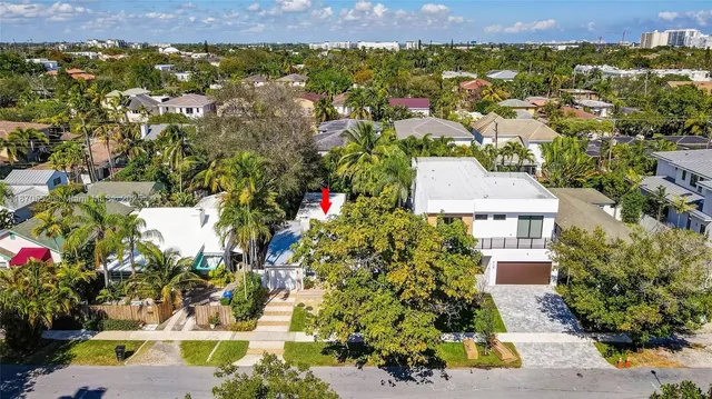 an aerial view of a house with a yard