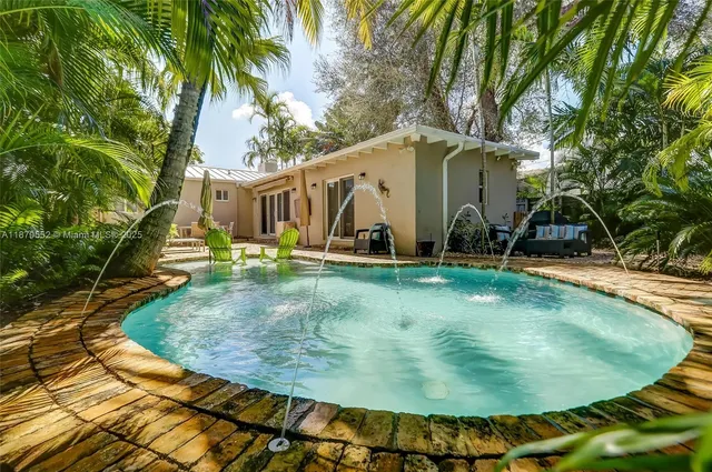 a view of a backyard with a fountain
