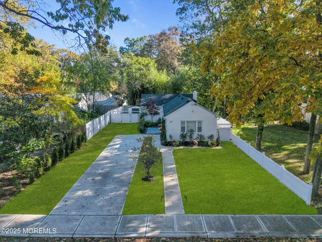 a view of house with garden space and street view