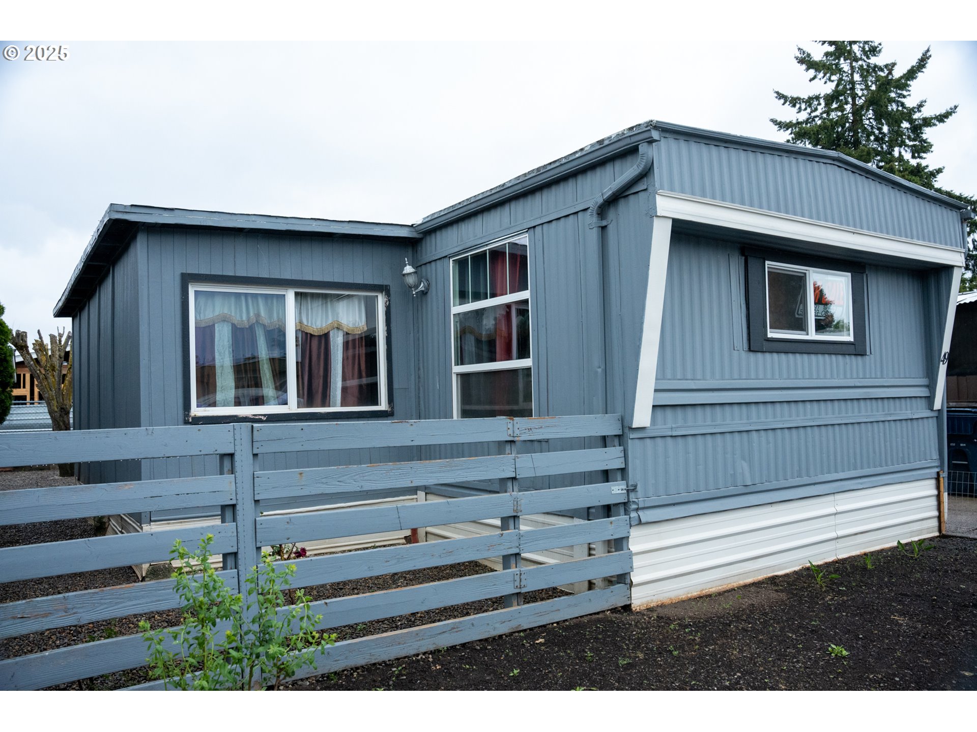 5335 Daisy Street, Unit TL 0130 Springfield, OR 97478 - Photo 1 of 17 a backyard of a house with lots of green space