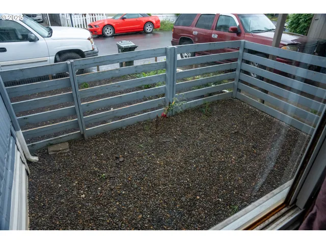 a kitchen with stainless steel appliances granite countertop a stove a sink dishwasher and cabinets with wooden floor