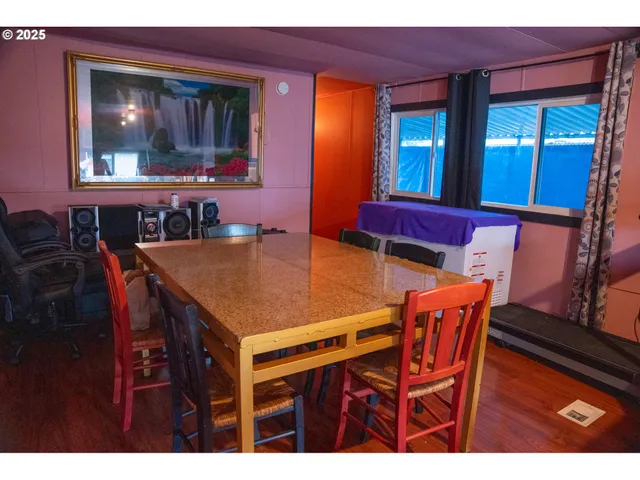 a dining room with furniture and window