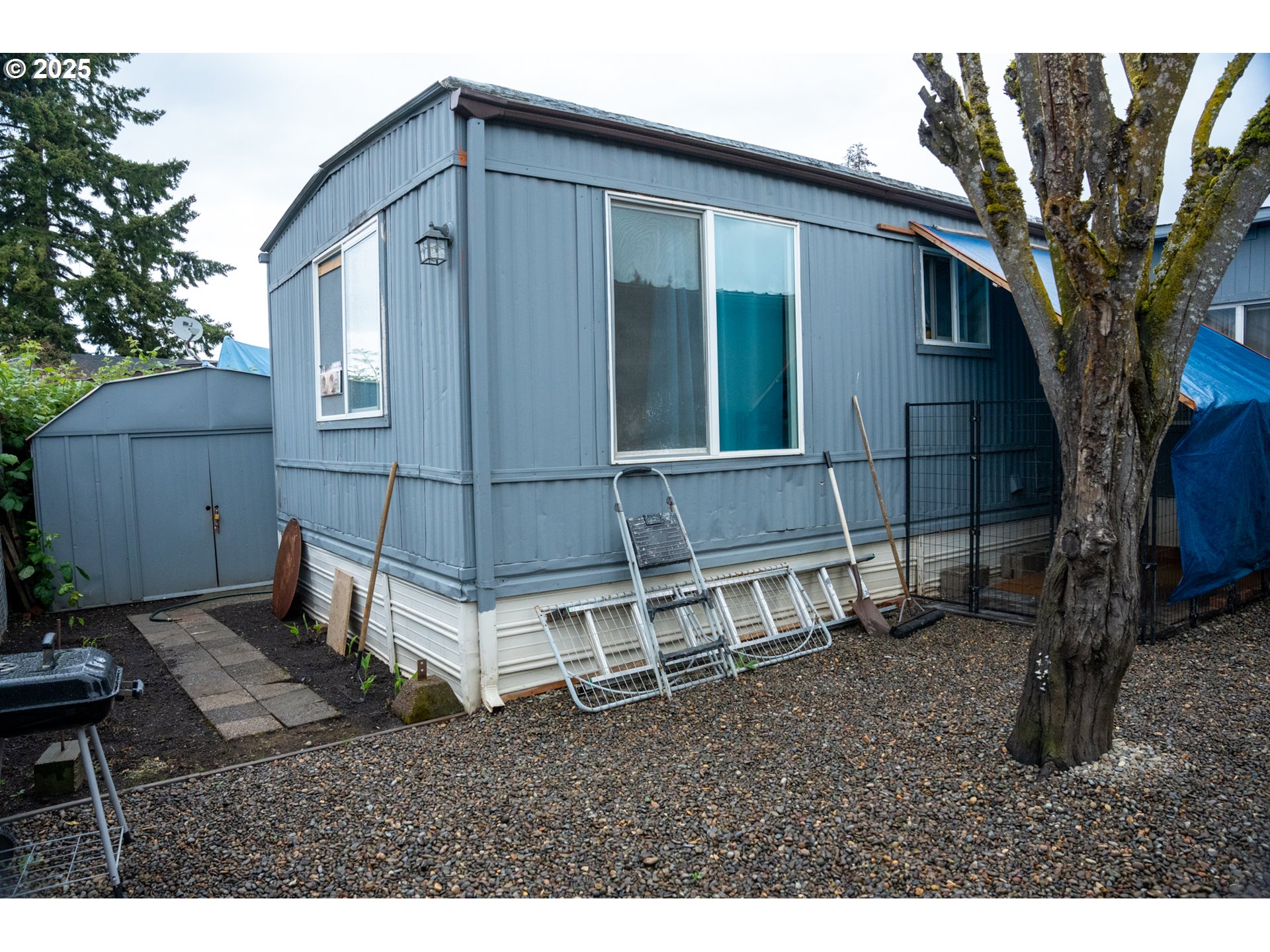 5335 Daisy Street, Unit TL 0130 Springfield, OR 97478 - Photo 4 of 17 a backyard of a house with table and chairs