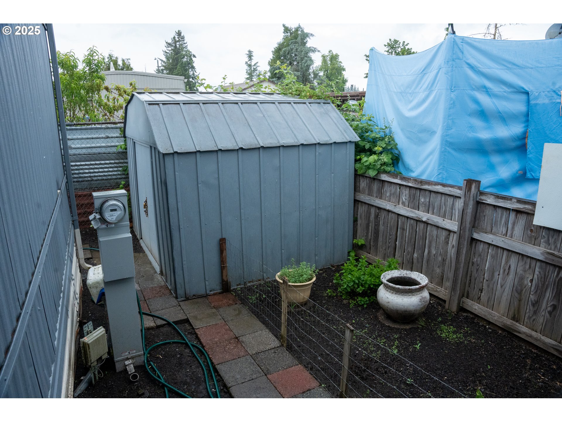 5335 Daisy Street, Unit TL 0130 Springfield, OR 97478 - Photo 8 of 17 a view of a backyard with a tub