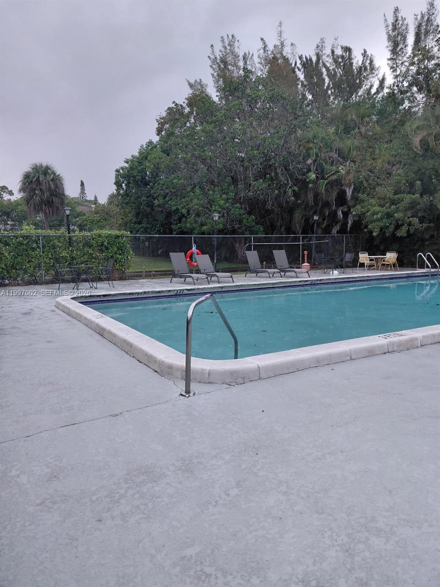 2980 Riverside Drive, Unit 1253 Coral Springs, FL 33065 - Photo 15 of 18 a view of a tennis court