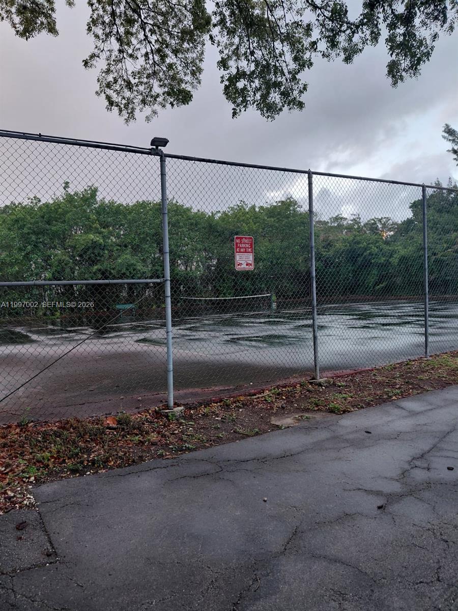 2980 Riverside Drive, Unit 1253 Coral Springs, FL 33065 - Photo 17 of 18 a backyard of a house with a road