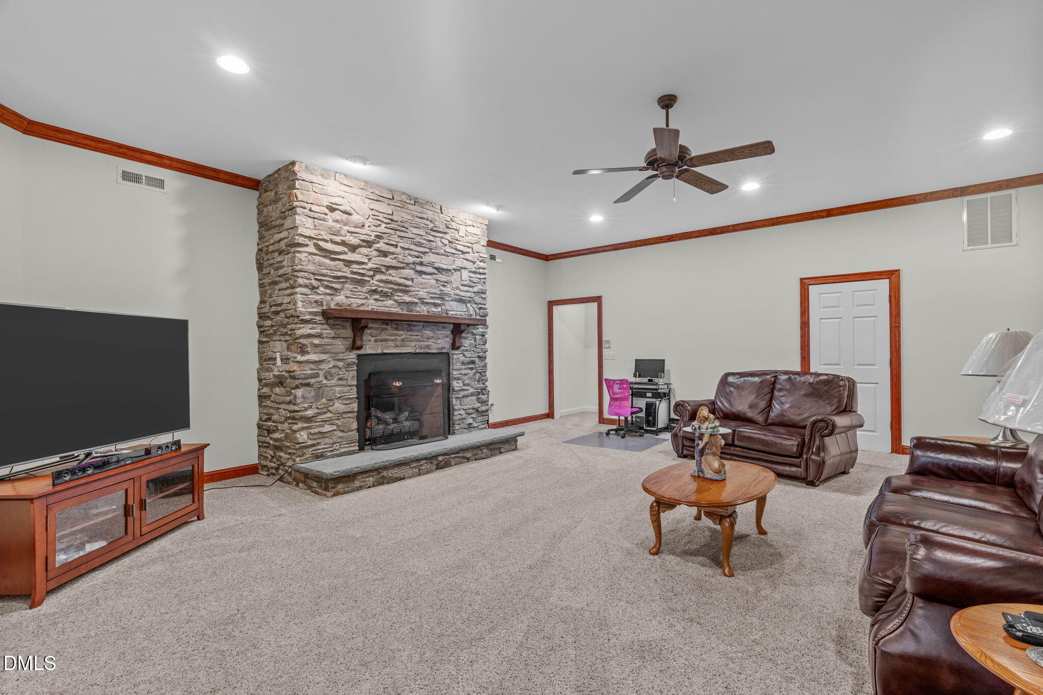 10917 Jordan Road Raleigh, NC 27603 - Photo 36 of 58 a living room with furniture and a flat screen tv