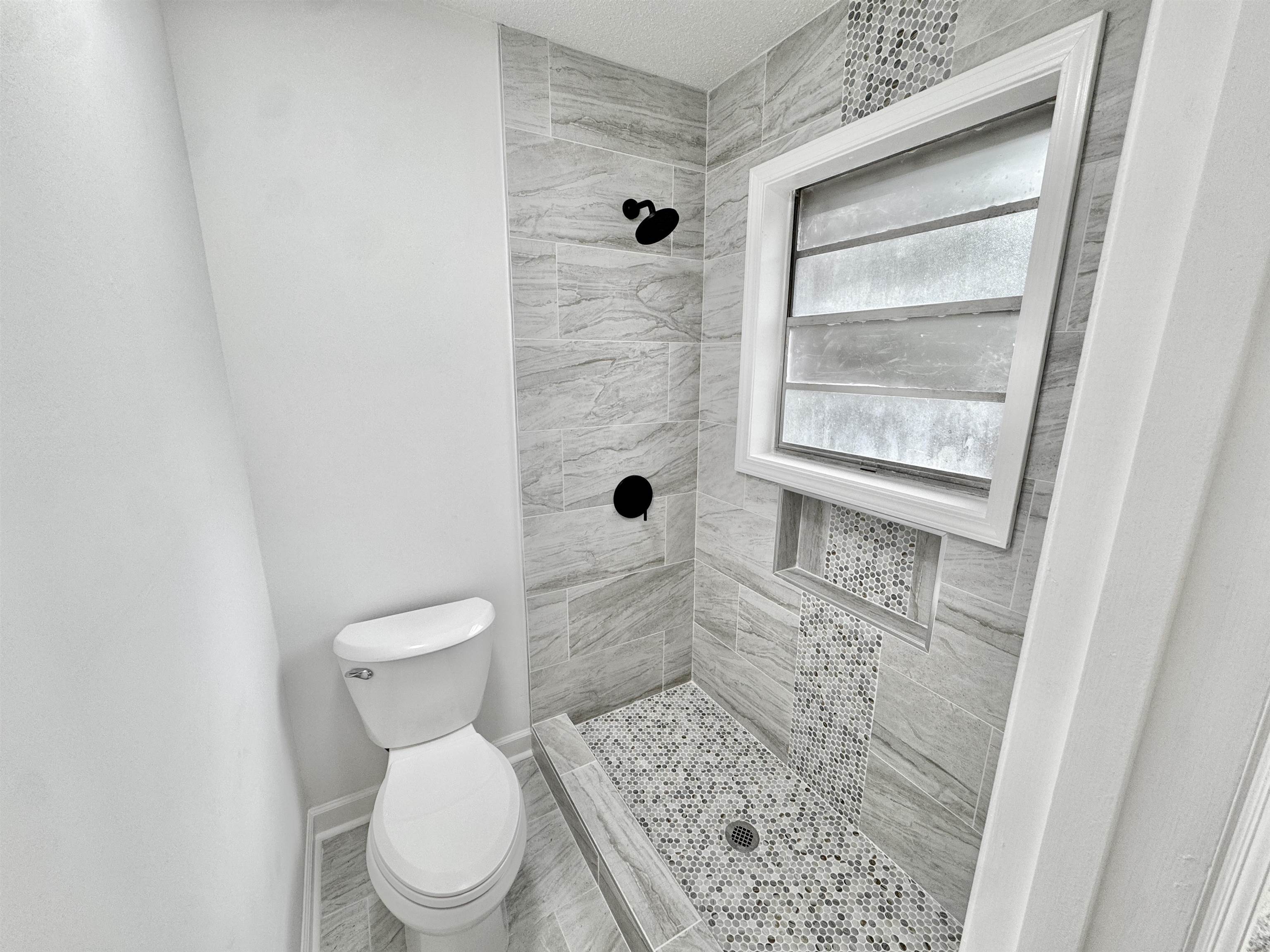 3209 Canyon Road Memphis, TN 38134 - Photo 14 of 30 a white toilet sitting next to a bathroom sink