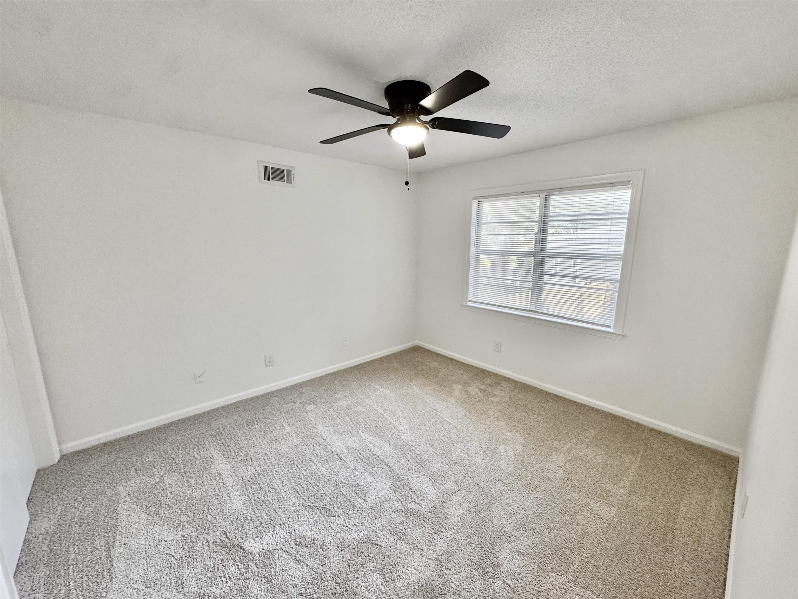 3209 Canyon Road Memphis, TN 38134 - Photo 19 of 30 a view of an empty room with a window