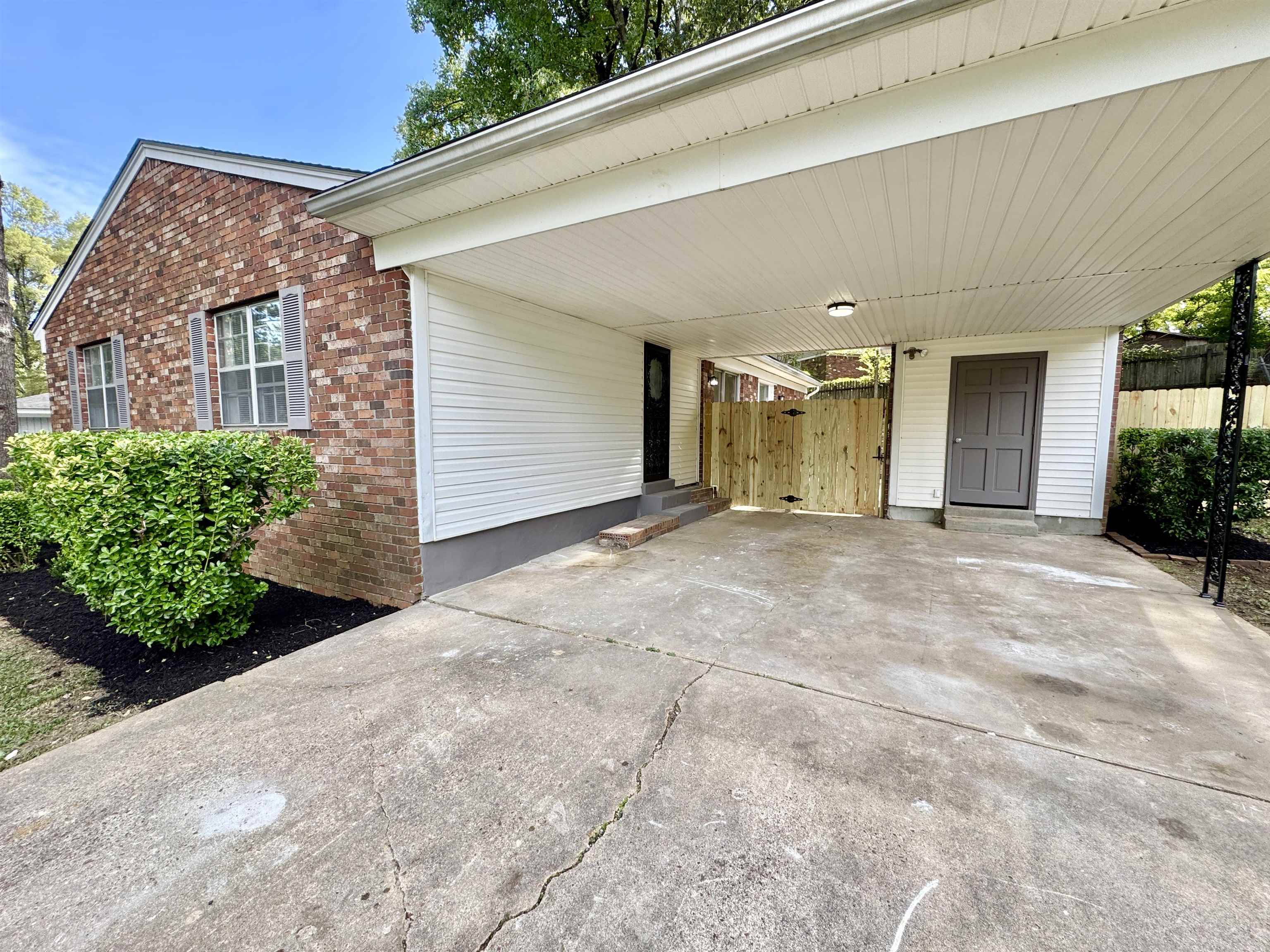 3209 Canyon Road Memphis, TN 38134 - Photo 2 of 30 a view of a blue house with a yard
