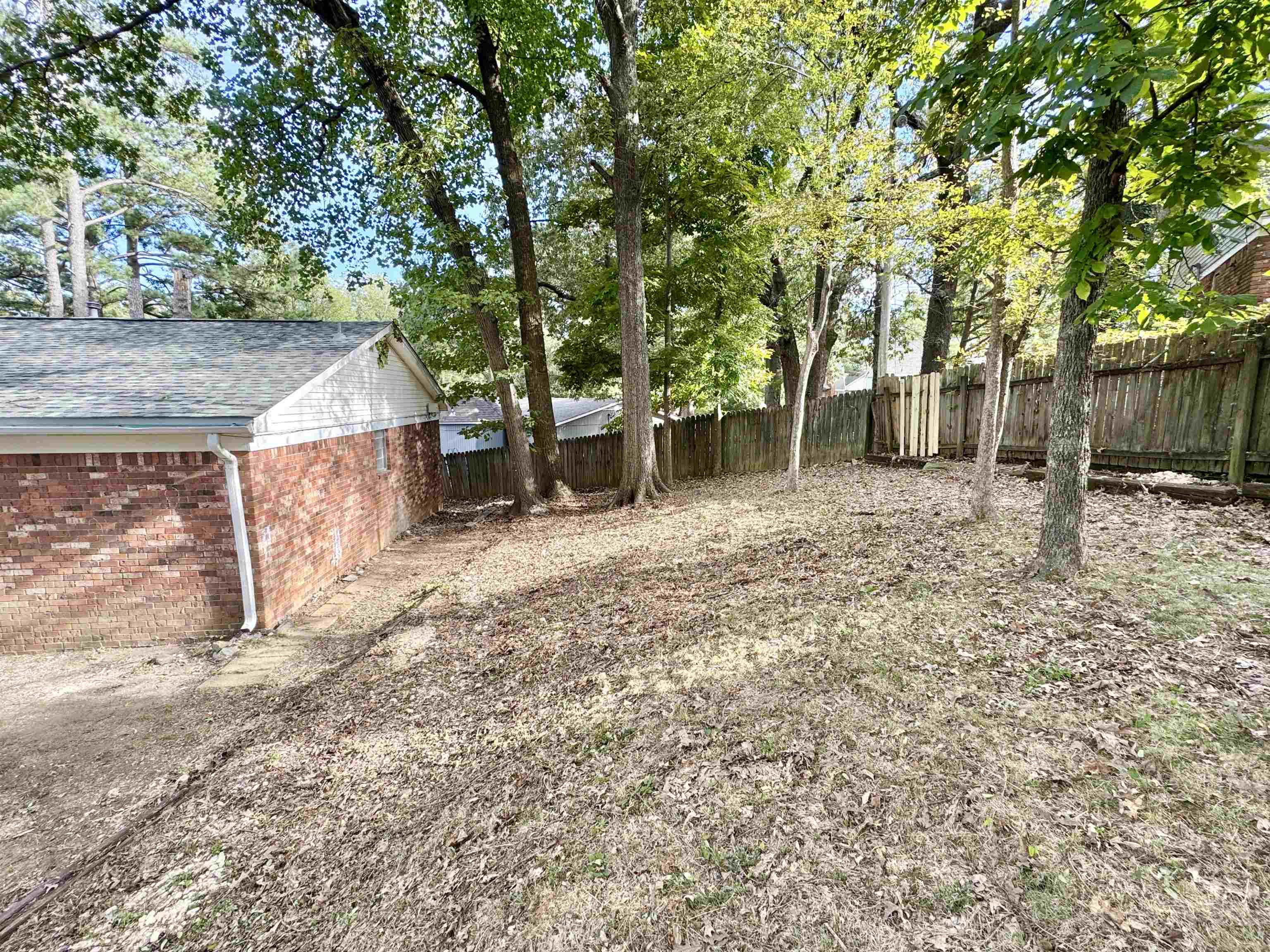 3209 Canyon Road Memphis, TN 38134 - Photo 27 of 30 a backyard of a house with lots of green space