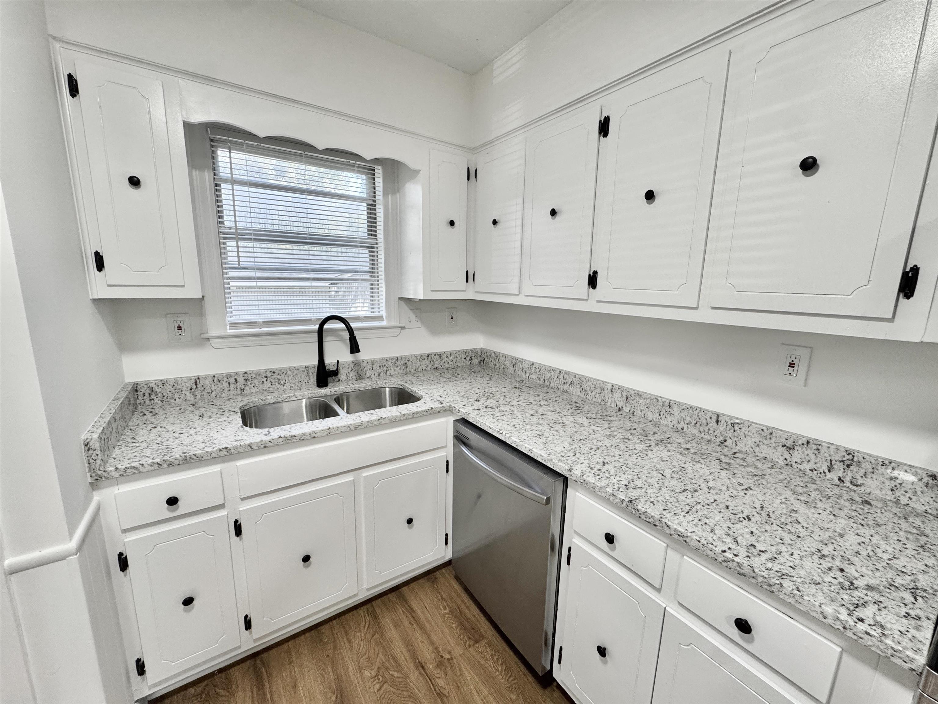 3209 Canyon Road Memphis, TN 38134 - Photo 7 of 30 a kitchen with granite countertop white cabinets and sink