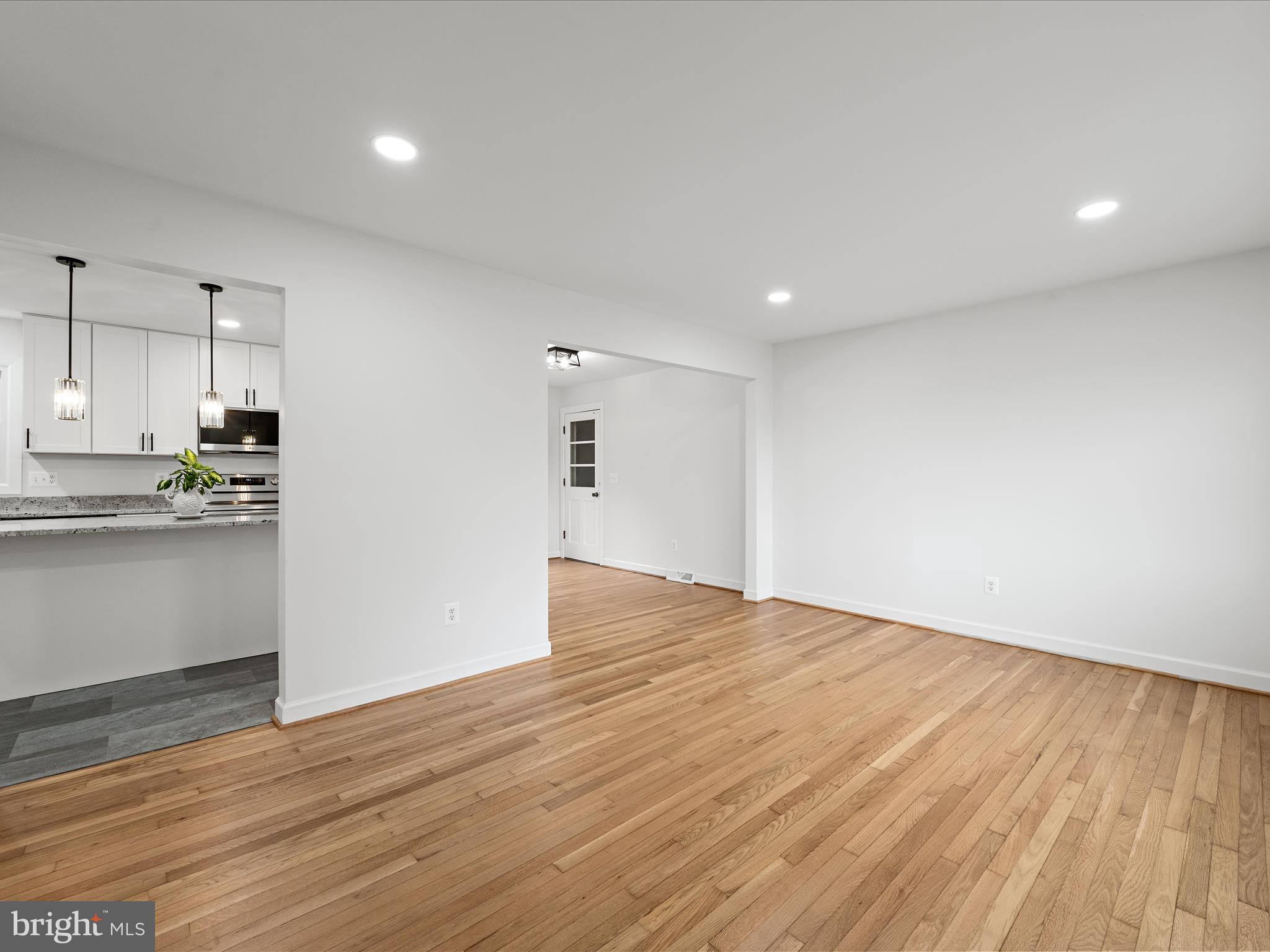 2311 Summit Point Road Summit Point, WV 25446 - Photo 14 of 46 a view of kitchen with wooden floor and electronic appliances