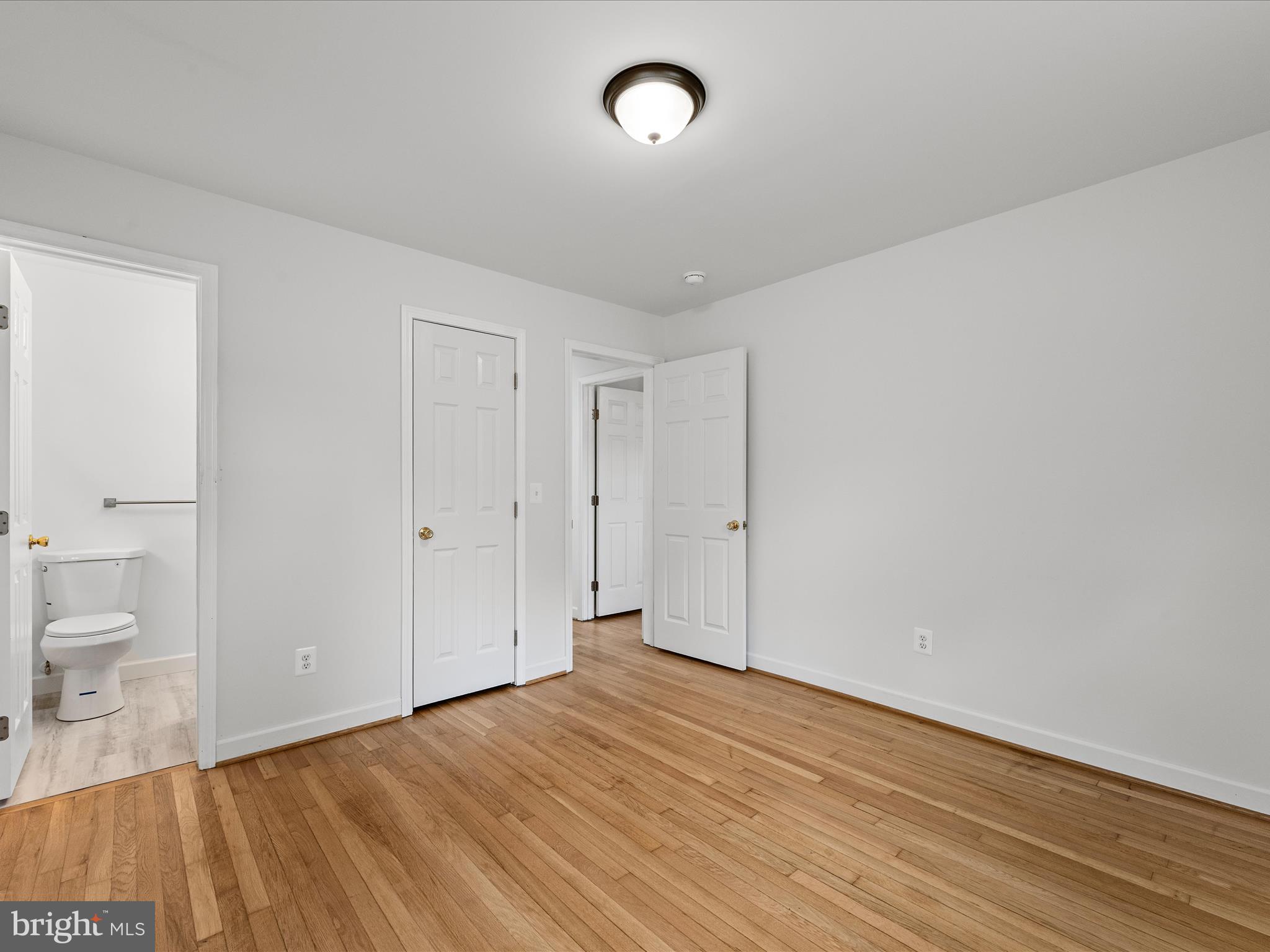 2311 Summit Point Road Summit Point, WV 25446 - Photo 20 of 46 a view of a room with wooden floor and window
