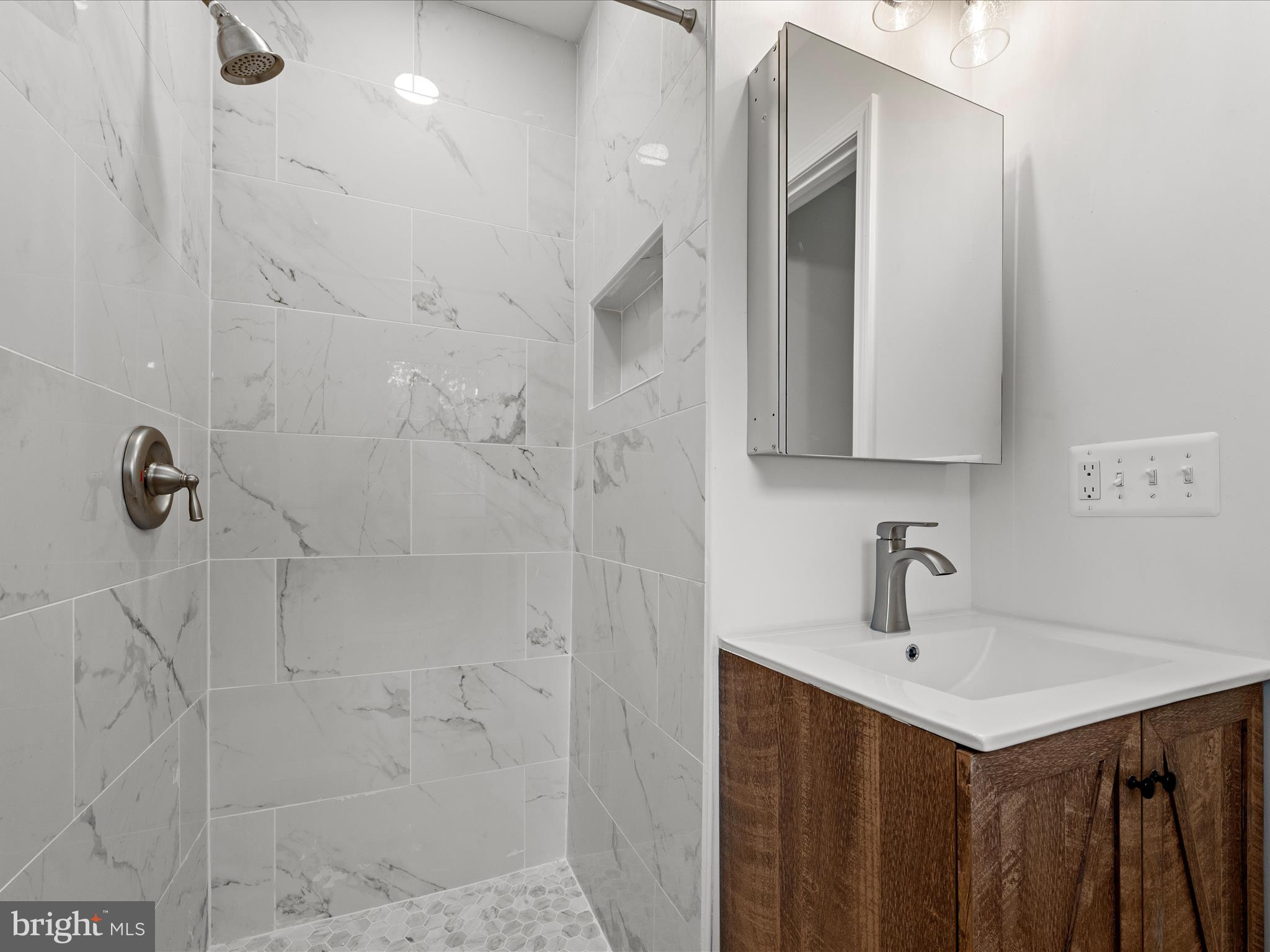 2311 Summit Point Road Summit Point, WV 25446 - Photo 22 of 46 a bathroom with a sink and a mirror