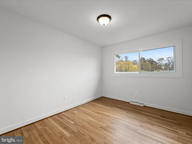 a view of a livingroom with wooden floor