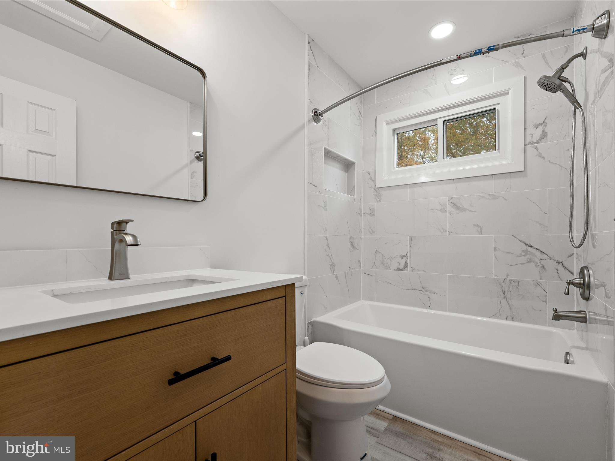 2311 Summit Point Road Summit Point, WV 25446 - Photo 25 of 46 a bathroom with a sink a toilet and bathtub