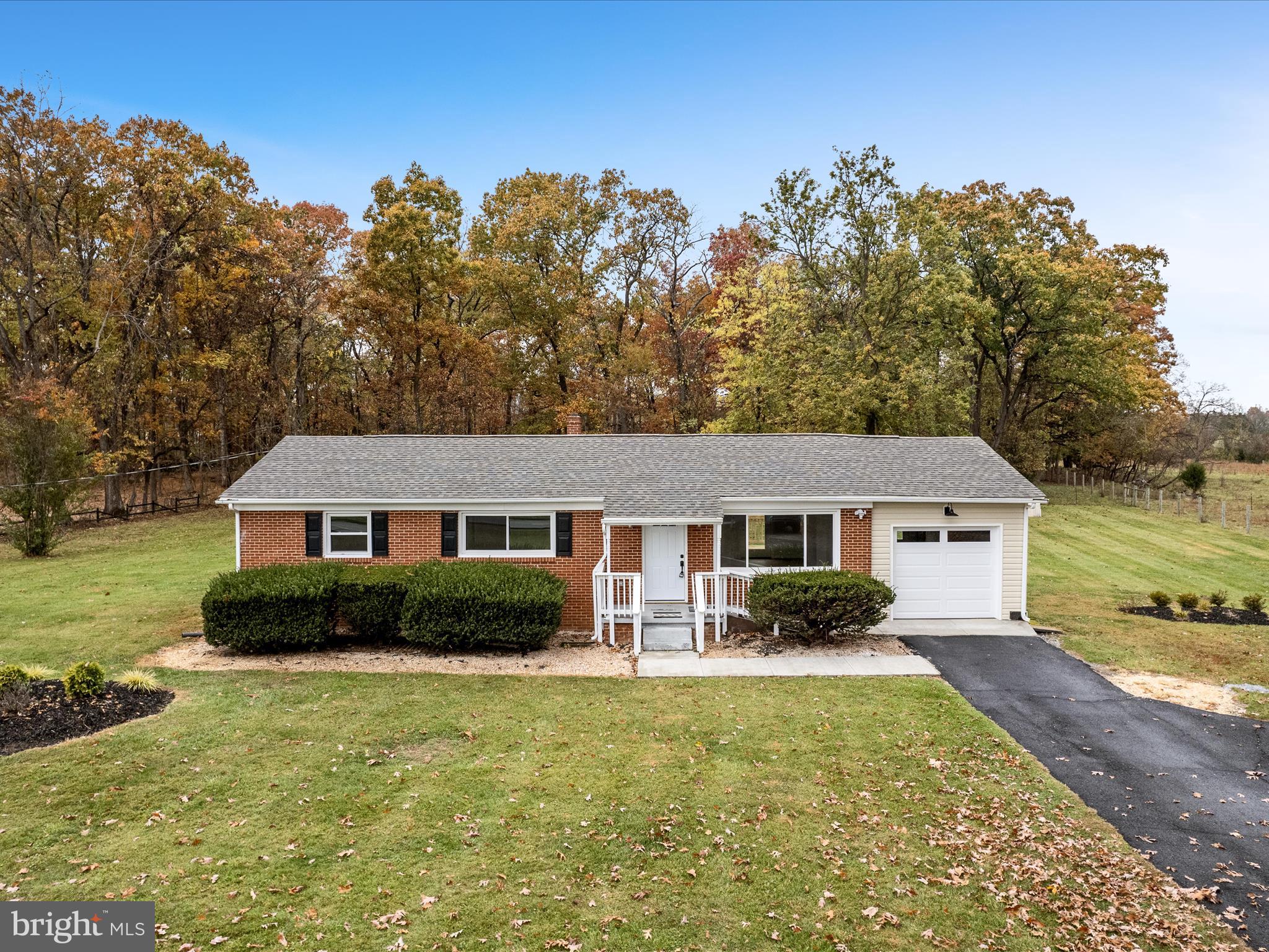 2311 Summit Point Road Summit Point, WV 25446 - Photo 3 of 46 a front view of a house with garden