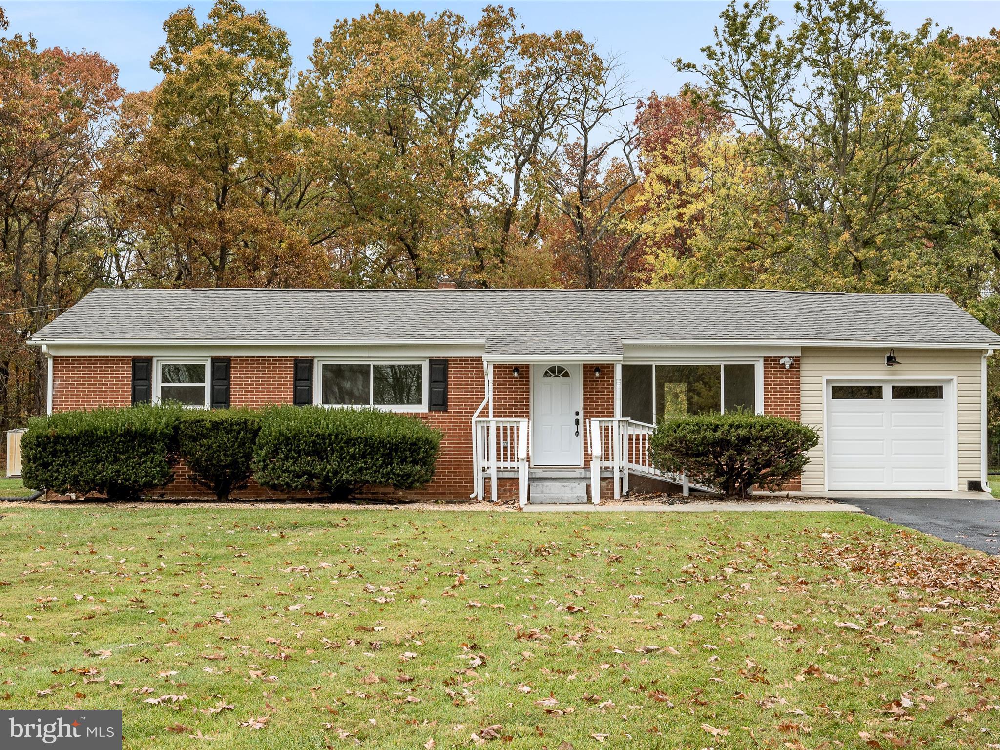 2311 Summit Point Road Summit Point, WV 25446 - Photo 34 of 46 a front view of a house with yard and green space