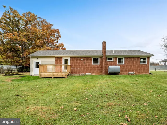 a view of a house with a back yard