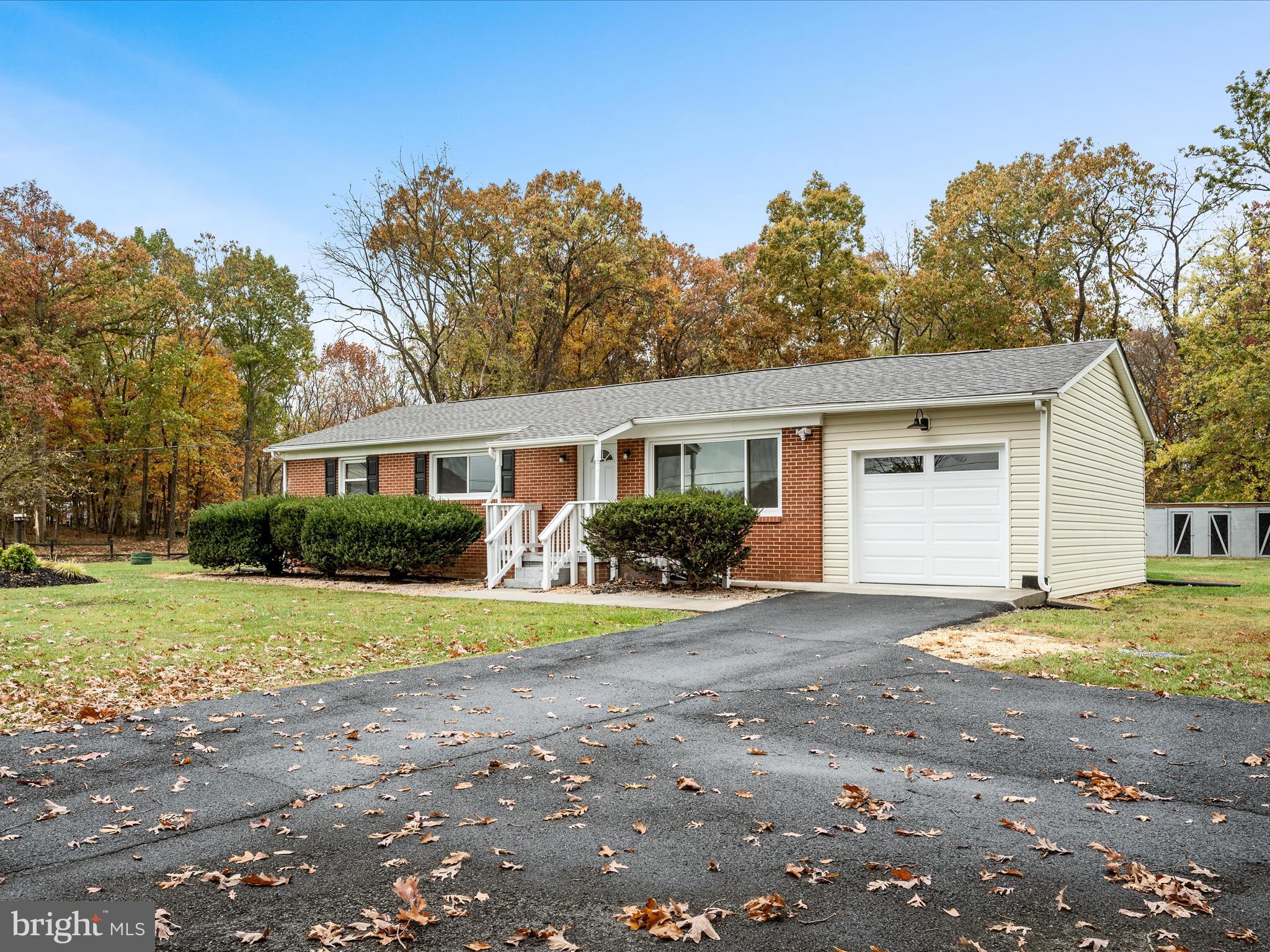 2311 Summit Point Road Summit Point, WV 25446 - Photo 45 of 46 a view of a house with a yard and large tree