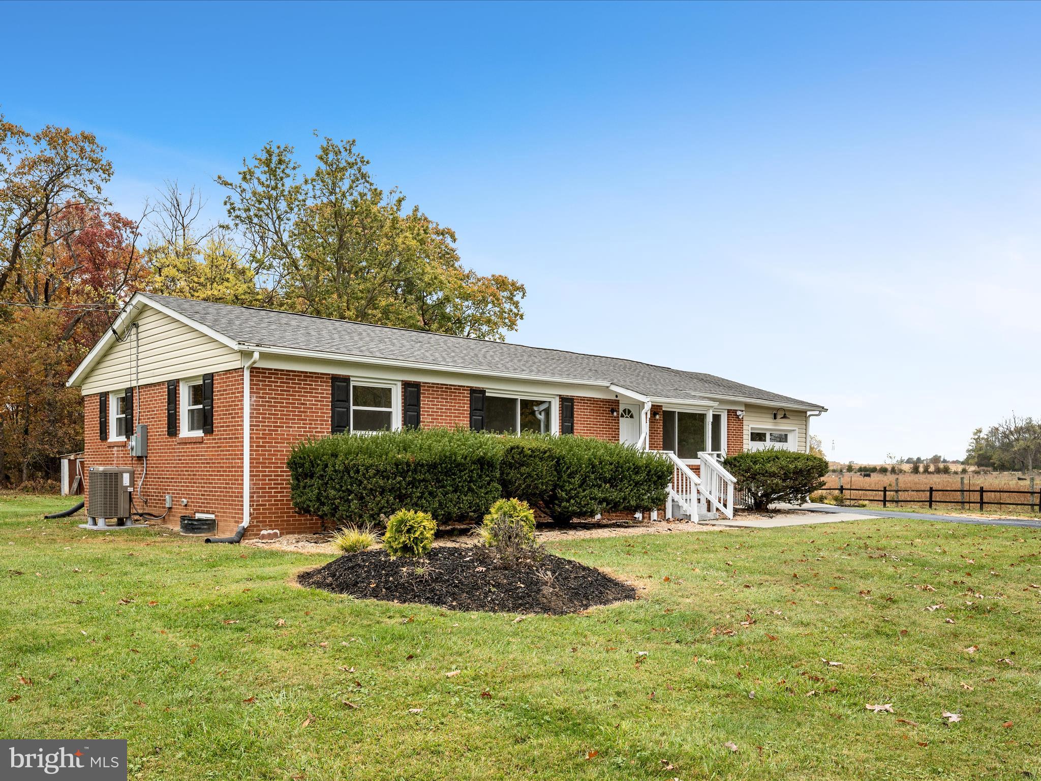 2311 Summit Point Road Summit Point, WV 25446 - Photo 46 of 46 a front view of a house with yard and green space