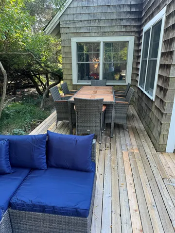 a view of house with backyard outdoor seating and green space