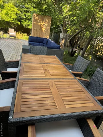 a view of outdoor space with furniture and umbrella